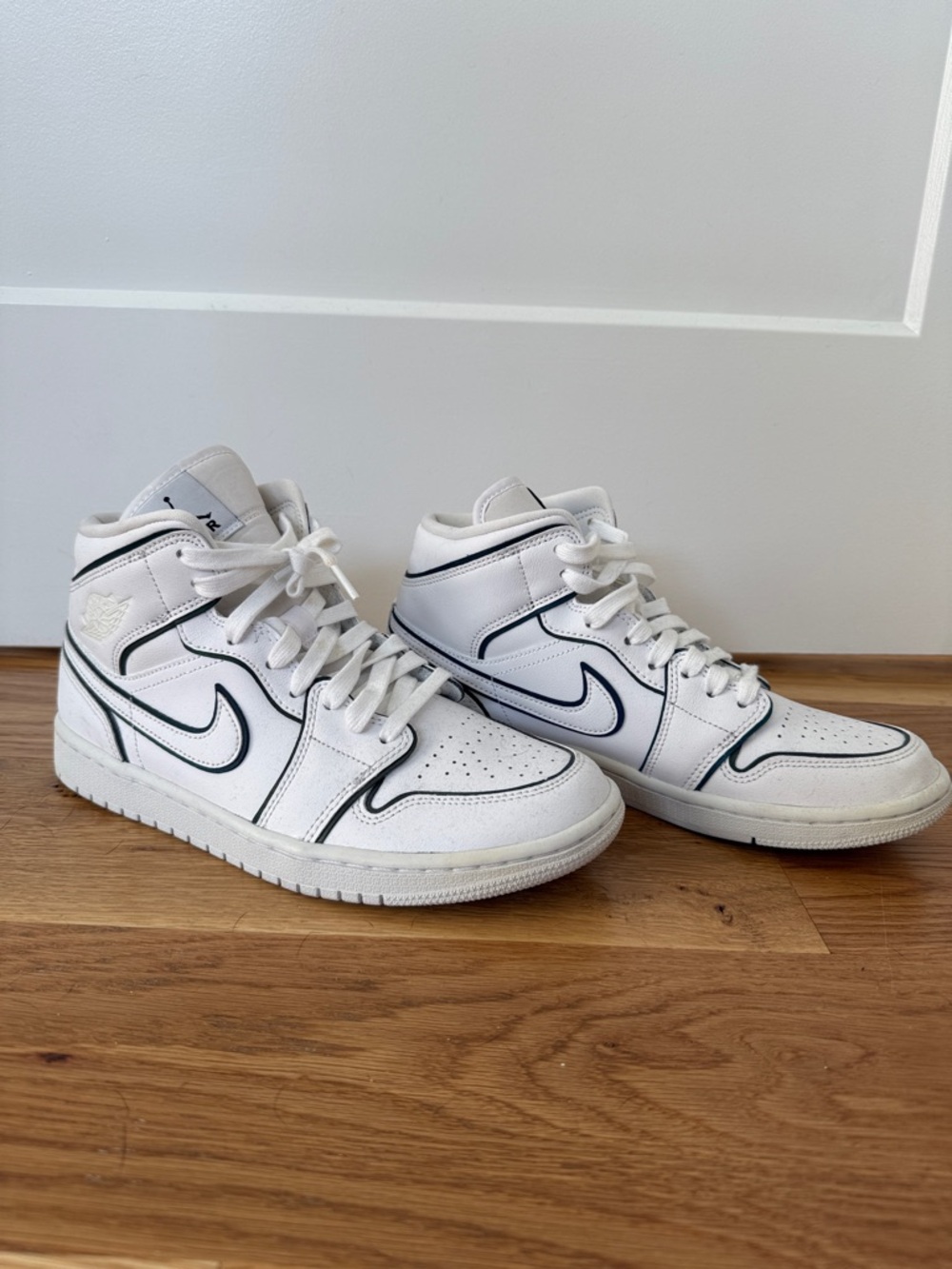 Nike White Mid-Top Sneakers with Black Trim